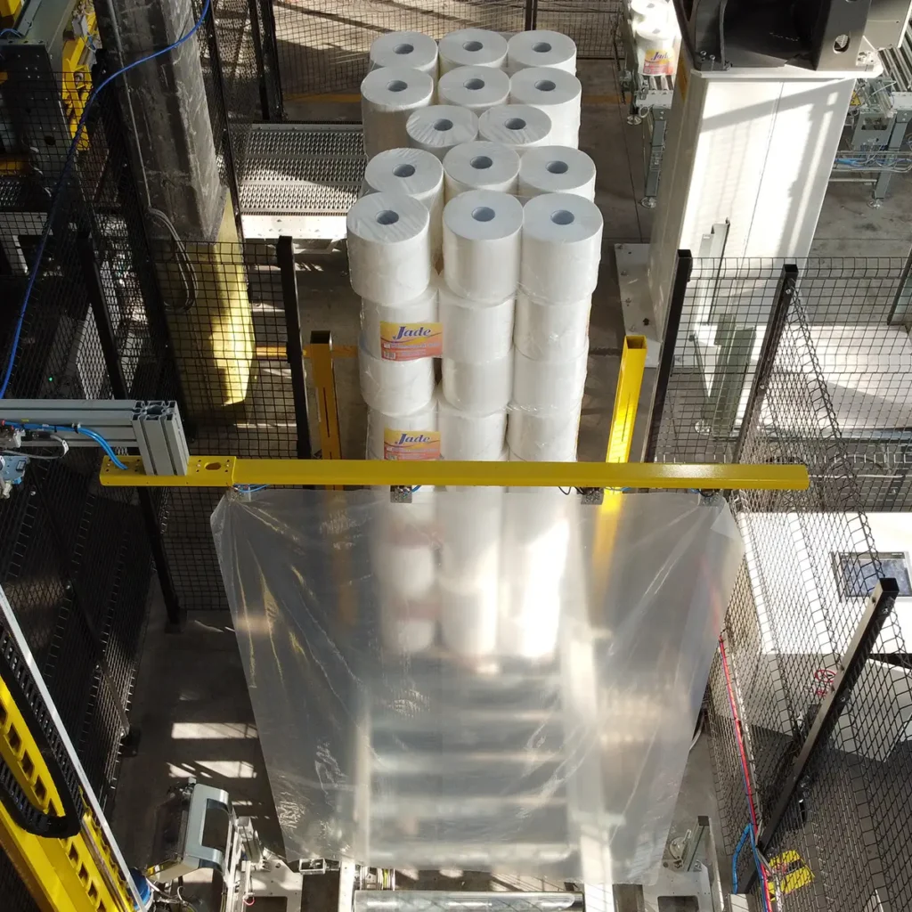Top view of the HERON system while covering pallets of industrial paper rolls.