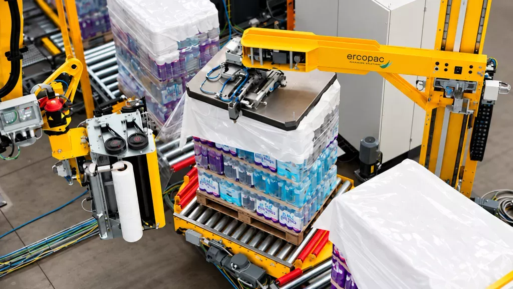 Spider Ercopac robotic wrapper wrapping a pallet with stretch film on an automated industrial line